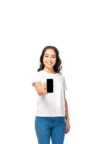Beautiful young asian girl showing smartphone with blank screen isolated on white - Fotografie, Obrázek