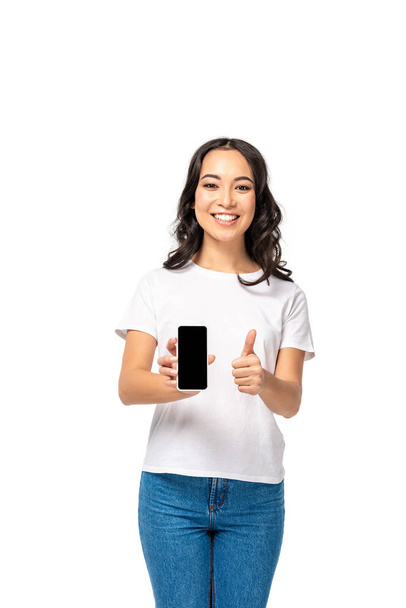 Beautiful asian girl holding smartphone with black screen and showing thumb up isolated on white - Foto, Imagem