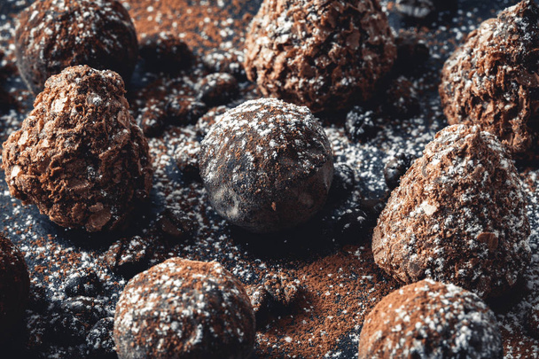 chocolate truffles on slate tray - Фото, изображение