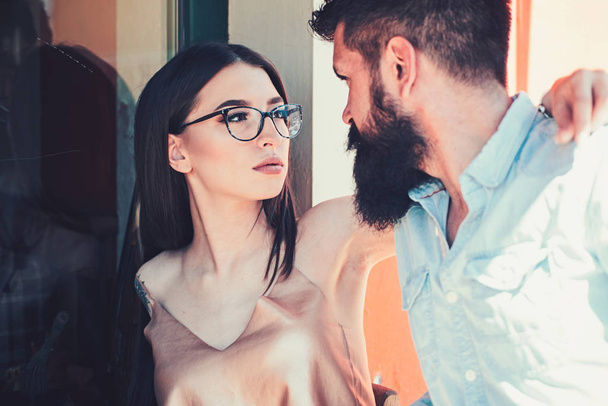 Fashion is passionate. Couple of lovers with fashion style. Girlfriend and boyfriend in relations of friendship. Couple in love. Sensual woman and bearded man in love relations. Fashion models - Photo, Image