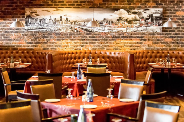 Johannesburg, South Africa - August 07 2013: Interior of Booth Style Restaurant Diner with Brown Interior - 写真・画像