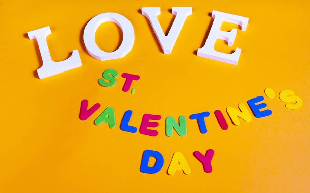 75 degrees picture of white word love and colored word valentine's day, in orange background - 写真・画像