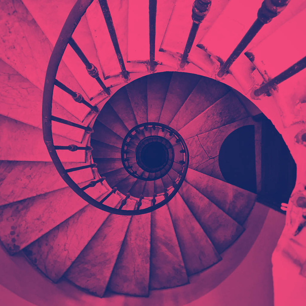 view of an ancient spiral staircase. Duotone color effect - Photo, Image