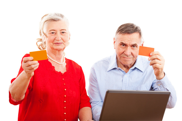Elderly couple doing online shopping - Fotoğraf, Görsel