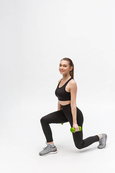 Allenati. Donna sportiva nella moda Abbigliamento sportivo Gambe stretching - Foto, immagini