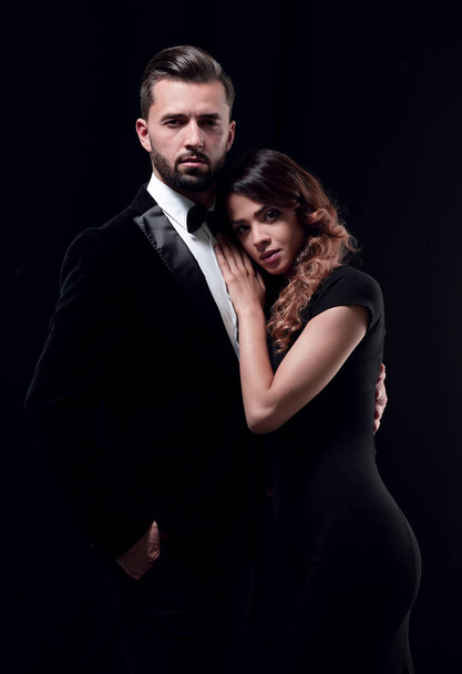 portrait of fashion couple on black background - Zdjęcie, obraz
