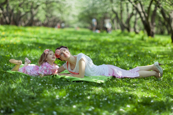 Girl and woman in the spring garden - Valokuva, kuva