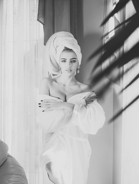 Girl with towel on head relaxing, after spa or shower. - Фото, зображення