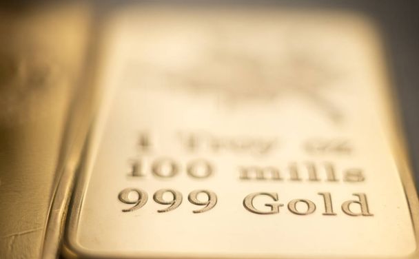 Gold bullion 999.9 purity solid one ounce ingot precious metal bars. - Photo, Image