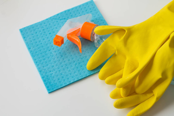 Woman hands with cleaning equipment on white background - Photo, Image