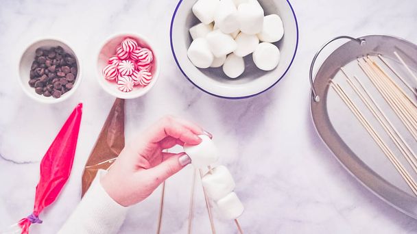 Step by step. Flat lay. Making marshmallow snowman and reindeer on sticks hot chocolate toppers for food gifting. - Fotografie, Obrázek