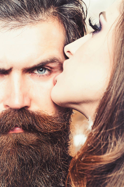Couple of woman and bearded man kiss, romantic relations. Couple in love and family concept - Fotoğraf, Görsel
