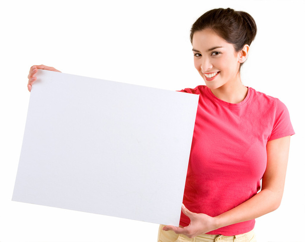 Mujer sosteniendo un signo blanco en blanco
 - Foto, Imagen