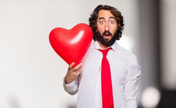 young crazy man with Valentines day concept - 写真・画像