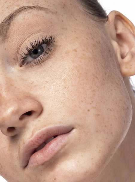 Beautiful young face with freckles. - Photo, Image