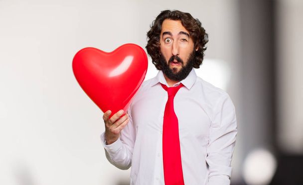 young crazy man with Valentines day concept - 写真・画像