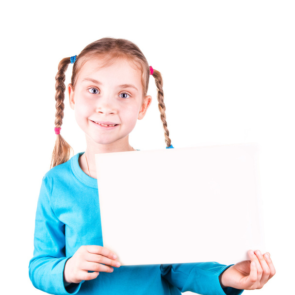 Smiling little girl holding white card for you sample text - Фото, зображення