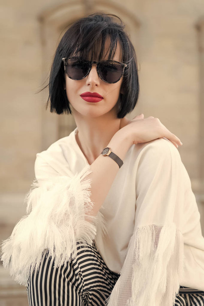Street fashion concept. Portrait of elegant young beautiful woman. Paris buildings as background, France - Фото, изображение