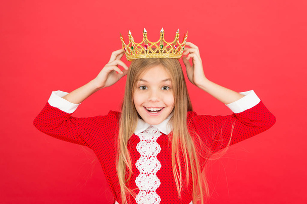 family and love. childrens day. small girl child. School education. Good parenting. Child care. happy little girl on red background. Childhood happiness. littlle princess in crown. Shocking news - 写真・画像