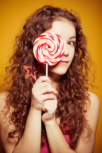 Happy young woman with lollipop - Фото, зображення