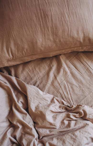 bedding items on the bed beige pillow blanket textiles - Fotoğraf, Görsel