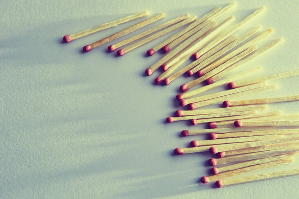 burned matches on a white background, a bunch of matches. and long shadows - Valokuva, kuva