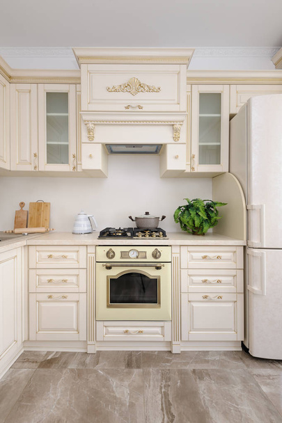 Modern beige colored luxury kitchen - Фото, изображение