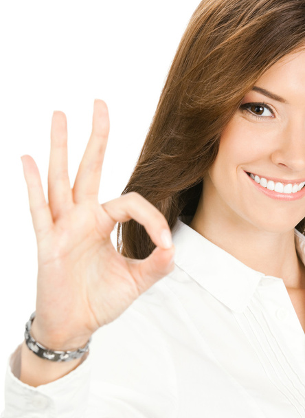 Businesswoman with okay gesture, isolated - Foto, afbeelding