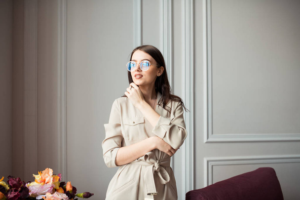 the girl wearing spectacles on a light background - Valokuva, kuva
