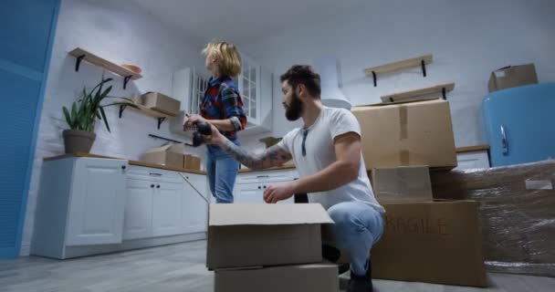 Young couple moving in their new home - Video