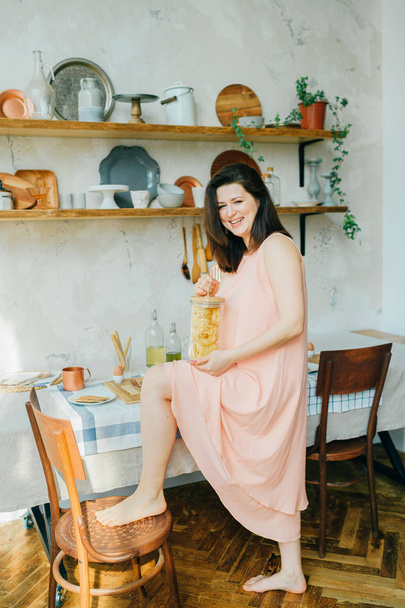 young beautiful woman in kitchen at home - Valokuva, kuva