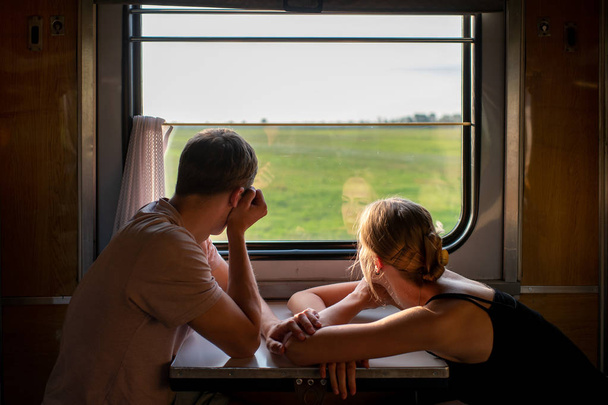 romantic couple of lovers travelling by train - Φωτογραφία, εικόνα