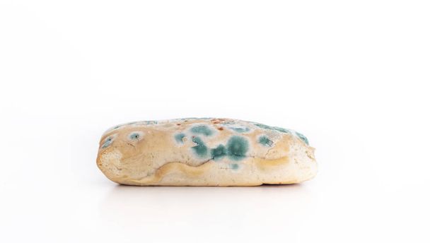 Old moldy bread on white background - Photo, Image