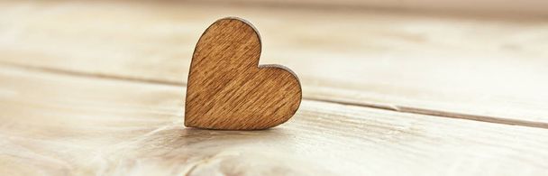 One wooden heart on the wooden table - Photo, Image