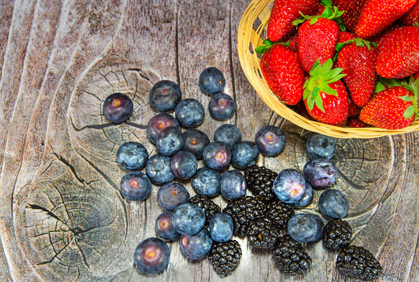 a lot of berries on wood - Photo, image