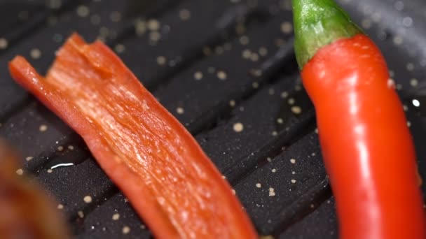 Prepare steak with hot peppers in a pan. slow motion - Footage, Video