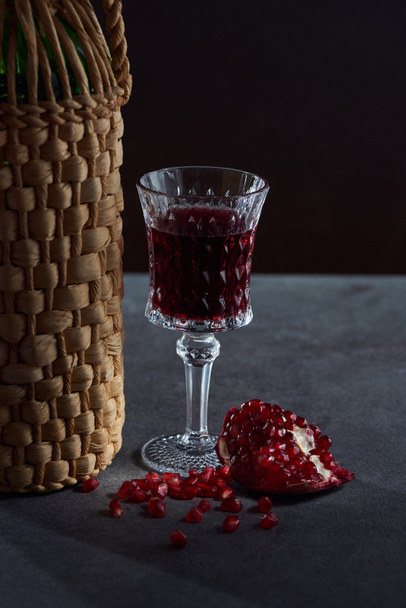 Studio shot of wine bottle, wineglass and garnet - Zdjęcie, obraz