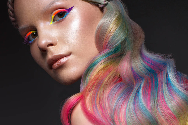 Beautiful girl with multi-colored hair and creative make-up and hairstyle. Beauty face. - Foto, Imagen