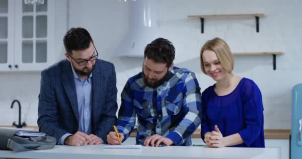 Husband signing property contract with his wife - Footage, Video