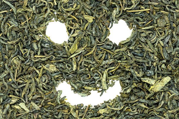 Χουανγκσάν Maofeng πράσινο τσάι, αστεία γελαστό πρόσωπο, κοντινό πλάνο. Κίνας κίτρινη τον διάσημο πράσινο τσάι του βουνού, με μια ελαφρά floral απόηχος. Τσάι χρησιμοποιούνται για να χάσει το βάρος και προάγει την κυκλοφορία του αίματος. - Φωτογραφία, εικόνα