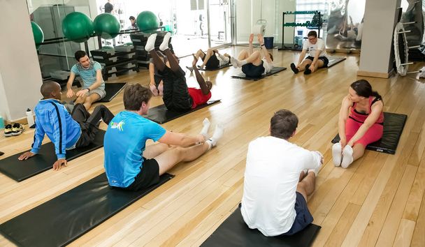 Johannesburg, South Africa - September 09 2013: Diverse Group of young people at a Pilates Class - 写真・画像