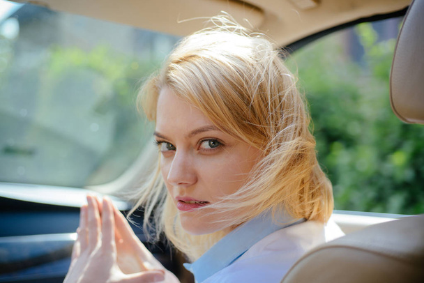 I like traveling. Pretty woman travel by automobile transport. Eco driving is an ecologic driving style. Sexy woman enjoy road trip. Eco friendly and sustainable travel. Traveling by road transport - Фото, изображение