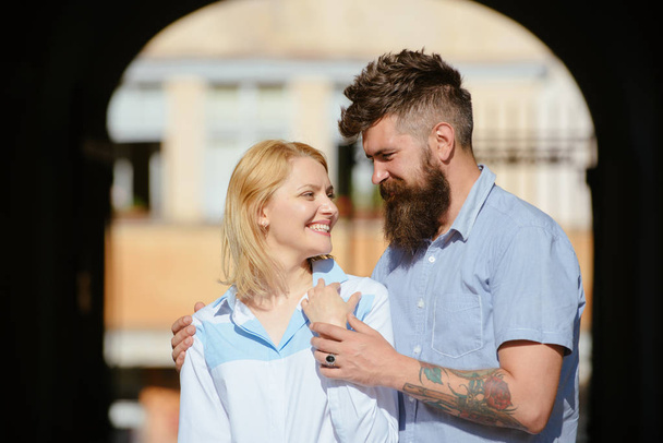 Falling in love with a blonde. Sensual woman and man enjoy romantic date. Couple in love. Loving couple of woman and hipster dating outdoor. Bearded man hug sexy girl. Feeling love and romance - Φωτογραφία, εικόνα