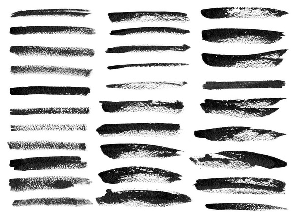 Black ink grunge brush set strokes on white background. - Photo, Image