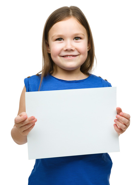 Little girl is holding blank banner - Valokuva, kuva