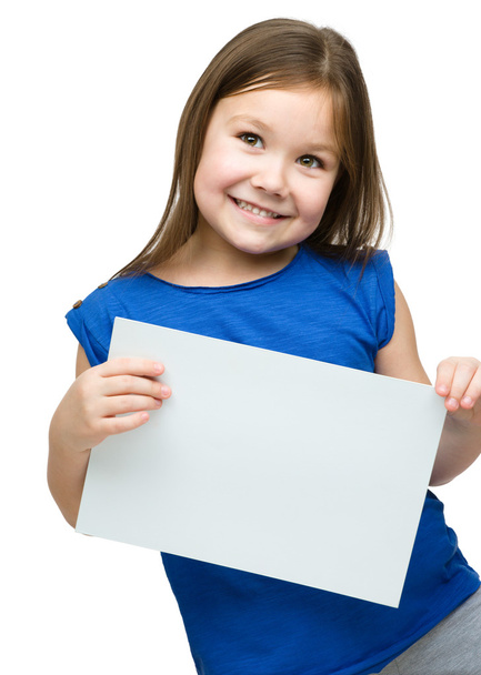 Little girl is holding blank banner - Фото, зображення