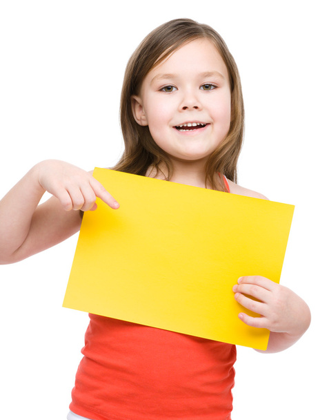 Little girl is holding blank banner - Фото, изображение