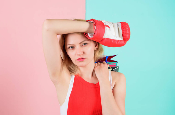 Tips to shop sales. Buy everything you want. Girl tired with shopping. Fight for personal discount. Survive black friday shopping. Woman red boxing glove hold bunch shopping bags blue pink background - Φωτογραφία, εικόνα