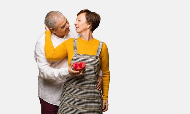 Middle aged couple celebrating valentines day - Foto, afbeelding