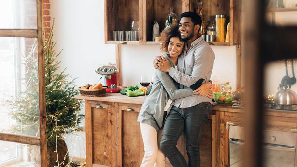 Young loving couple having good time at christmas morning - Photo, Image